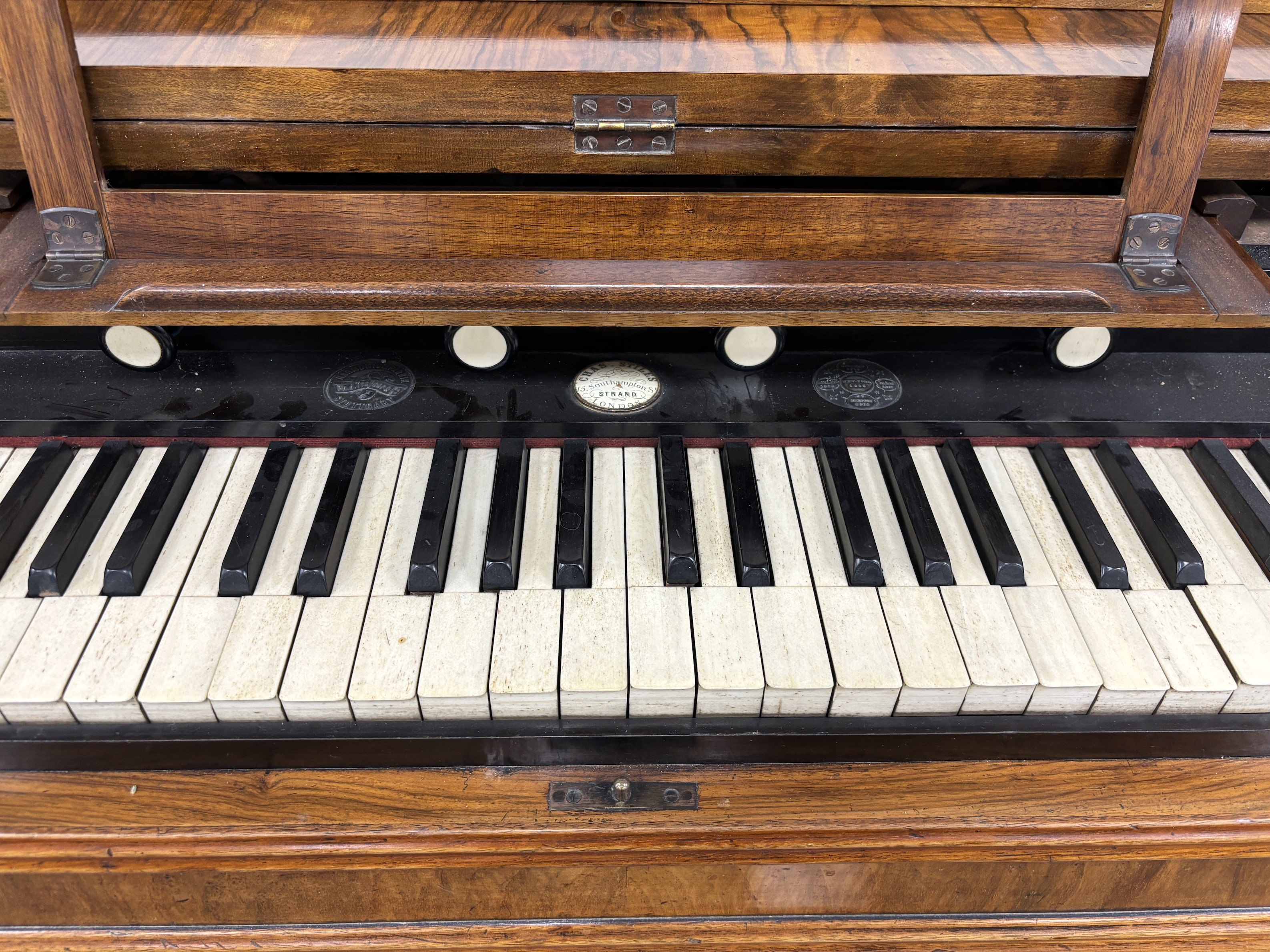 A Victorian walnut harmonium, width 106cm, depth 49cm, height 88cm